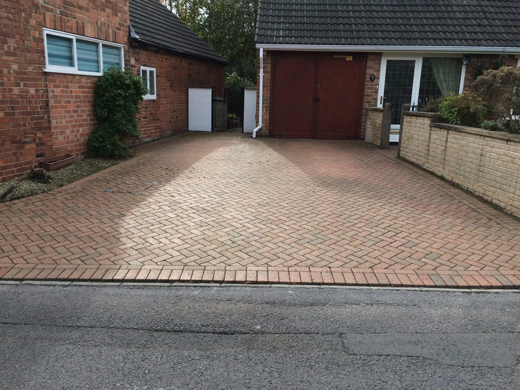 Patio slabs after pressure washing and black-spot treatment